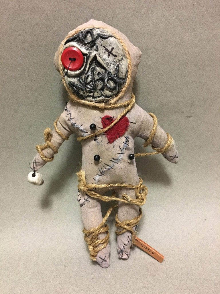 </br><p align="left"><strong><em>Voodoo Doll</em></strong></br>10.5" tall</br>Fabric, mixed media</br>$65</br><strong><a href="https://checkout.square.site/buy/FCCXT7KCJQAO3Y26LH3ZXLGF">PURCHASE</a></strong></p><br>