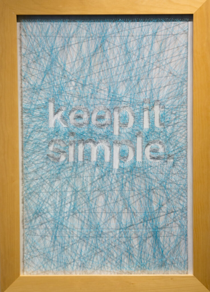 "Keep It Simple"; 2015; String, nails, and wood; 24x33 in; NFS. "Happy, Joyous, and Free!" Exhibit. March 19 - May 5, 2017.